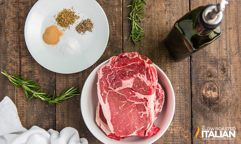 raw beef and seasonings on plate