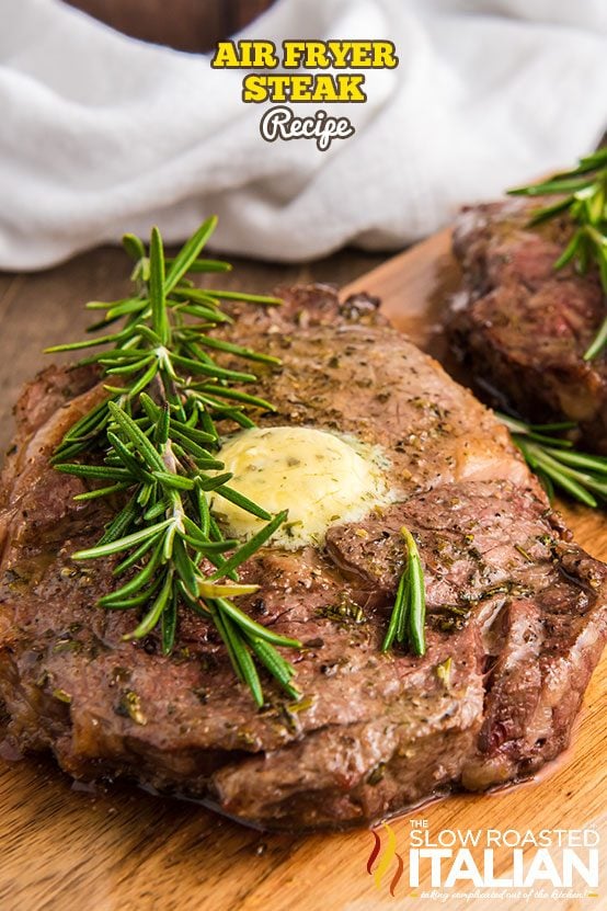 A close up of air fryer steak with rosemary sprig