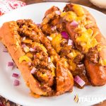 chili cheese dog on white plate