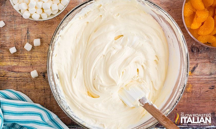 combining cream cheese salad ingredients in bowl