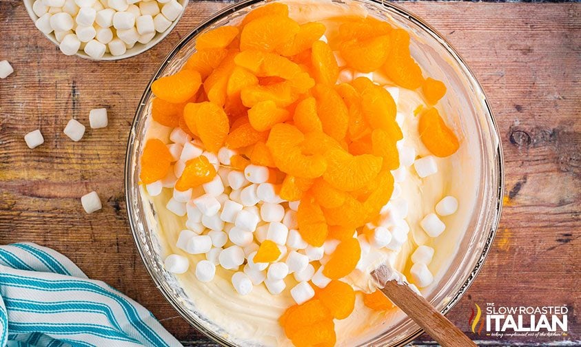 combining ingredients in bowl for mandarin orange salad