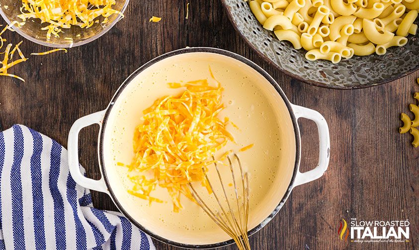making cheese cheese sauce in a white pot