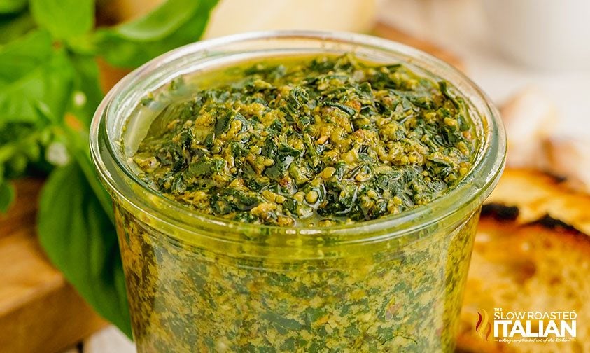 pesto basil sauce in a clear jar