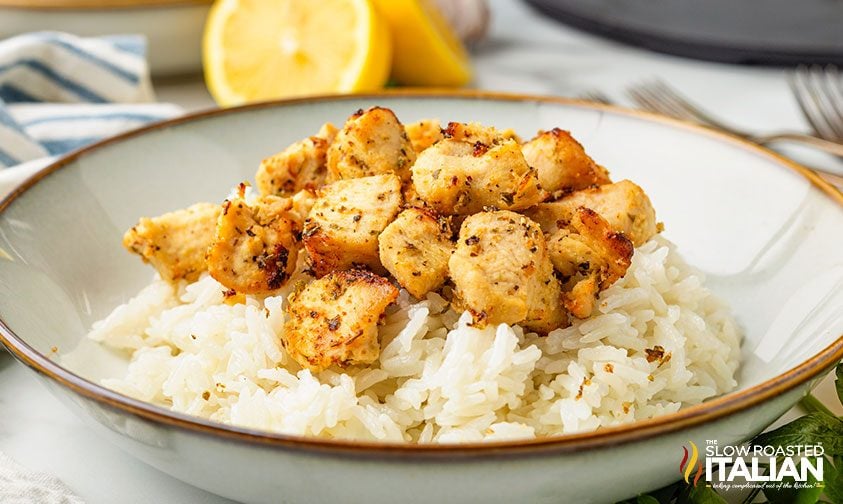 air fryer chicken bites on plate over white rice