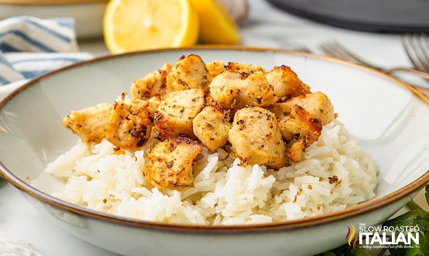 air fryer chicken bites on plate over white rice