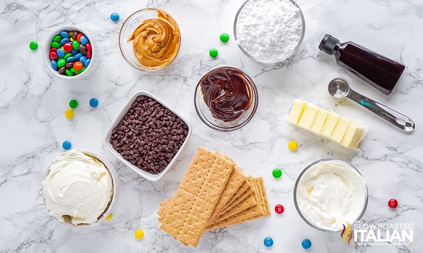 no-bake cheesecake ingredients in bowls on counter