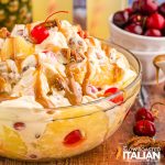 pineapple chunks, maraschino cherries, caramel sauce and pecans in cheesecake mixture