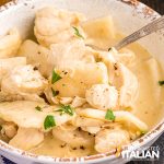 cracker barrel dumplings in bowl with gravy and meat