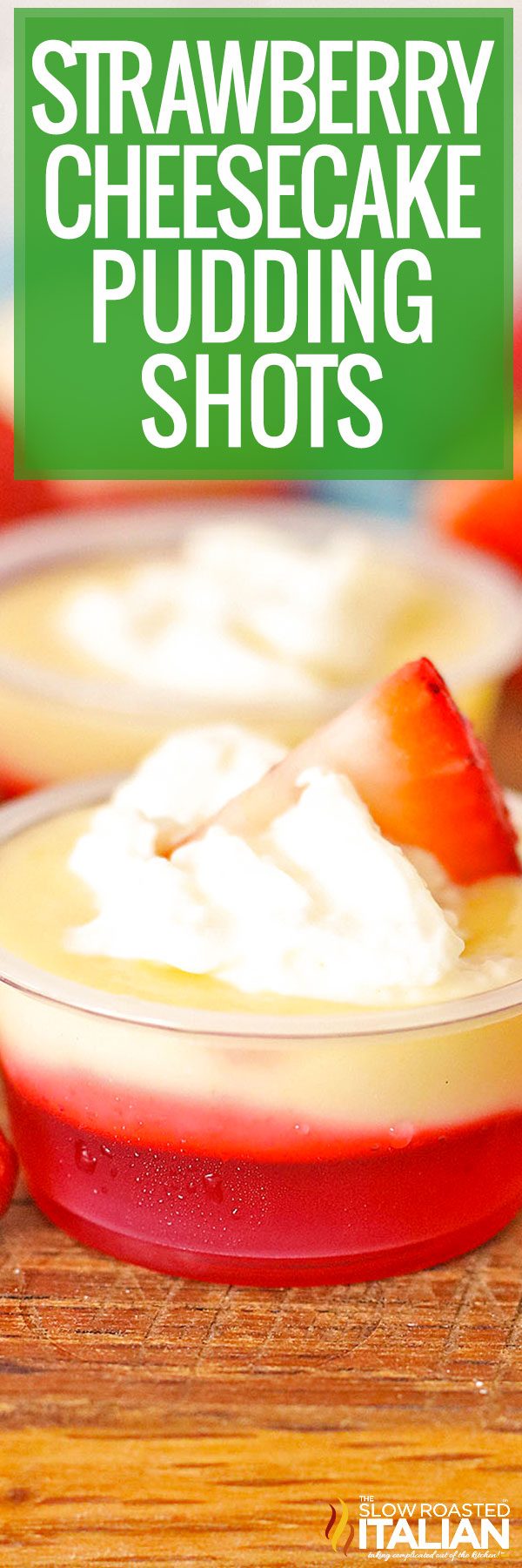 titled image (and shown): Strawberry Cheesecake Pudding Shots close up of whipped cream and sliced strawberry