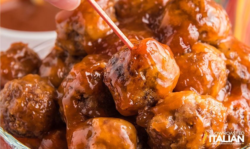 sweet and sour meatballs close up, toothpick in one