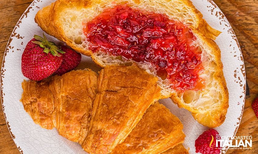 berry jam spread on a croissant
