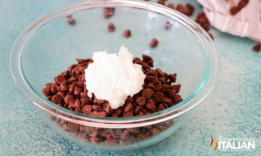 chocolate chips and coconut oil in glass bowl