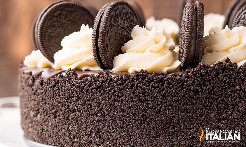 cookies and cream cheesecake topped with sandwich cookies and whipped cream