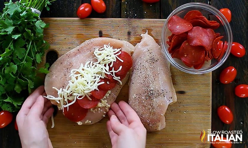 making stuffed chicken breasts with cheese and pepperoni