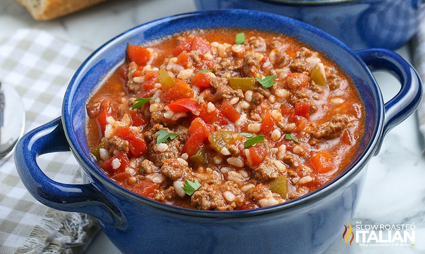 stuffed peppers soup in blue bowl, close up