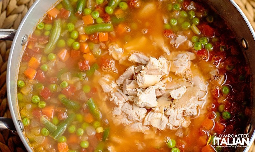 chicken and vegetables in soup pot