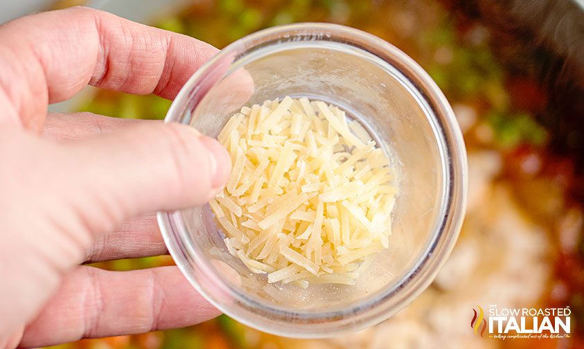 shredded parmesan cheese in small bowl