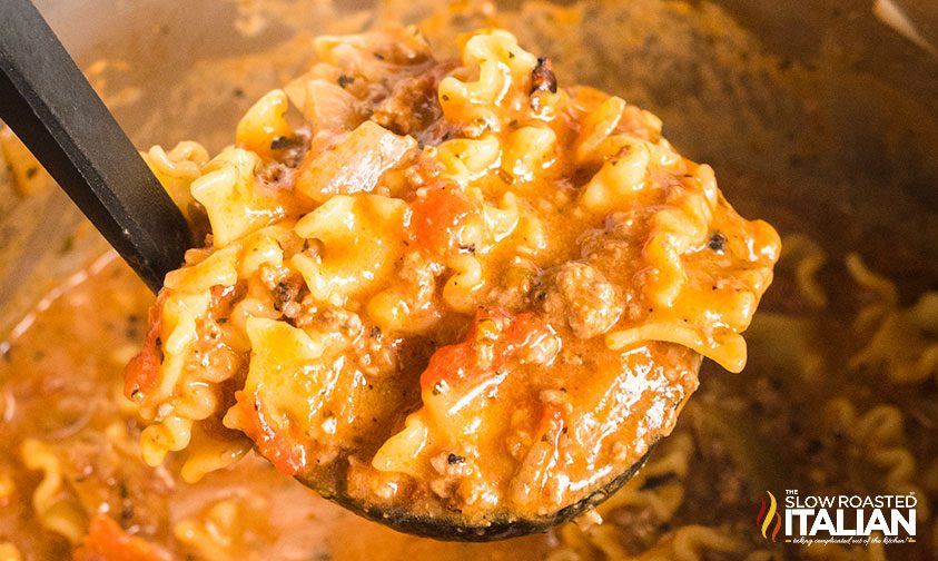 instant pot lasagna soup on ladle, close up