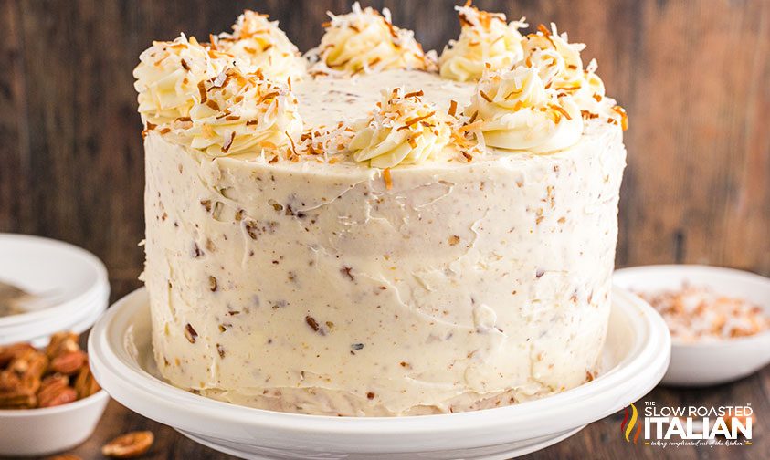 frosted italian cream cake topped with toasted coconut