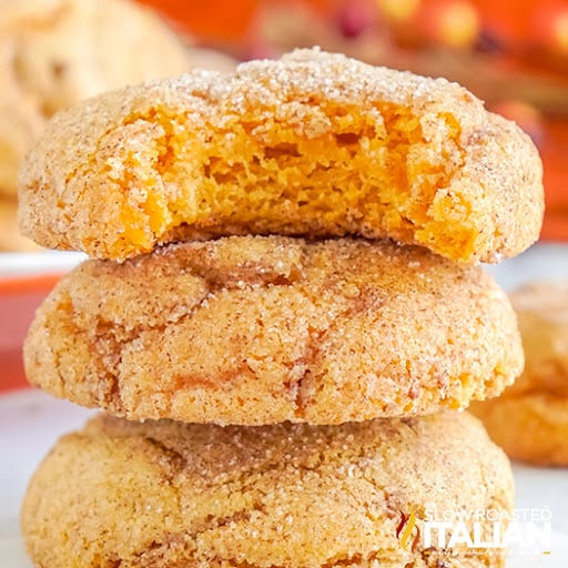 stacke pumpkin snickerdoodle cookies with bite taken from top cookies