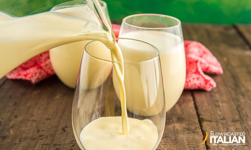 pouring best eggnog into drinking glasses