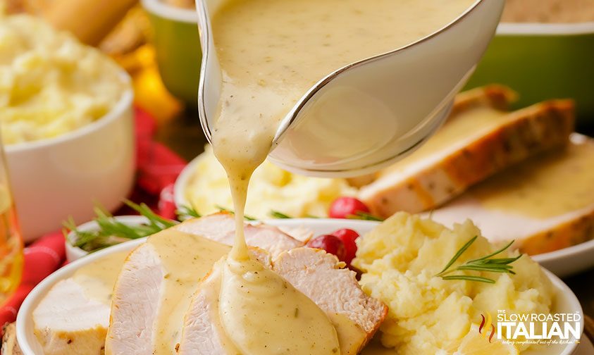 pouring creamy gravy from a gravy boat