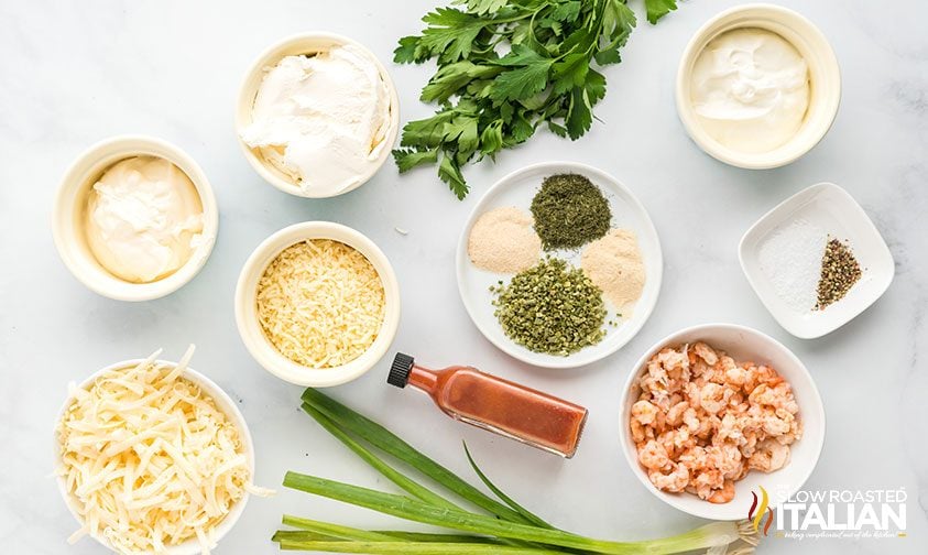 shrimp dip ingredients in bowls on counter