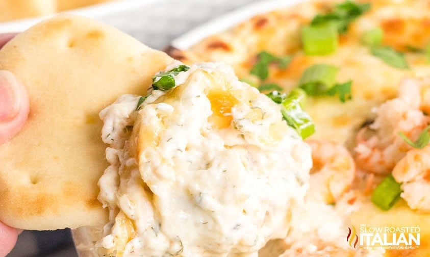 seafood dip on cracker, close up