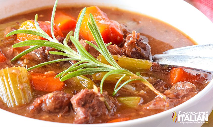 Instant Pot beef stew in a white bowl with chunks of meat and vegetables