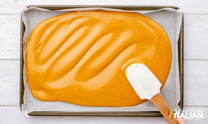 pumpkin spice cake batter in a pan