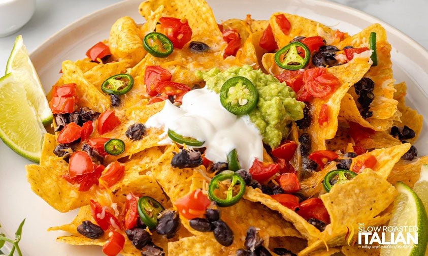 air fryer nachos on a plate with toppings