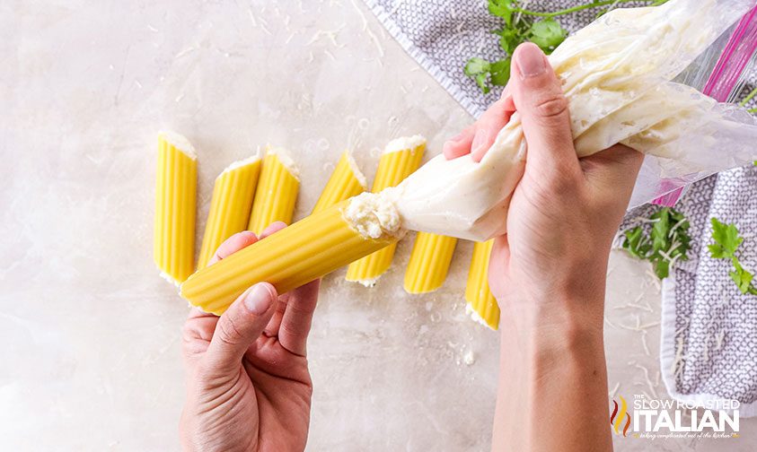 filling pasta tubes with ricotta filling