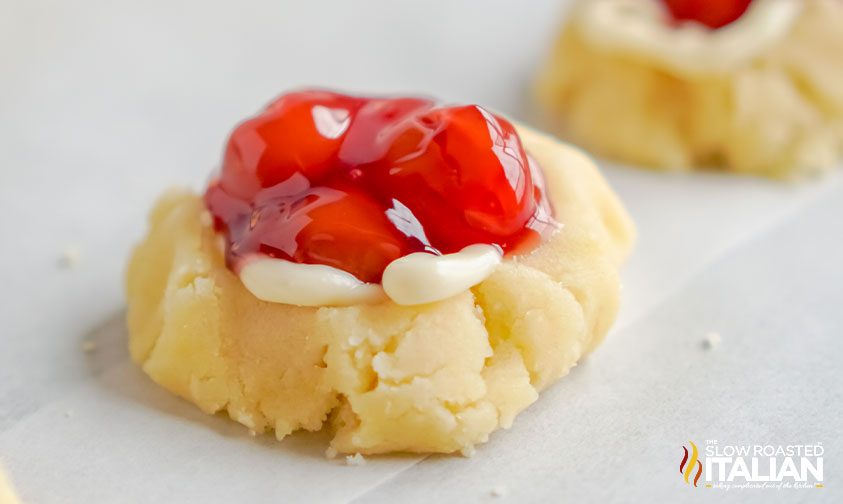 cheesecake cookie with red fruit filling on top