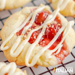 cherry pie filling on cookie drizzled with white chocolate