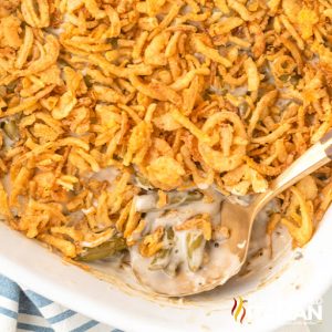 spoon in casserole topped with fried onions