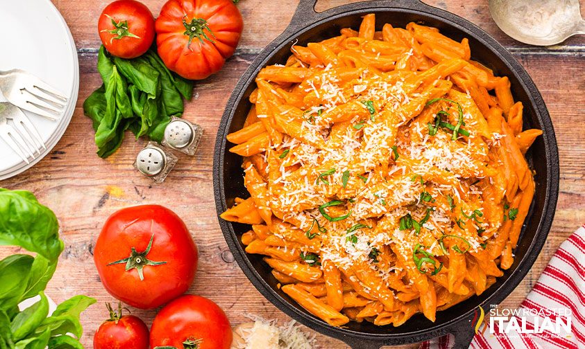 penne alla vodka in a cast iron skillet on table