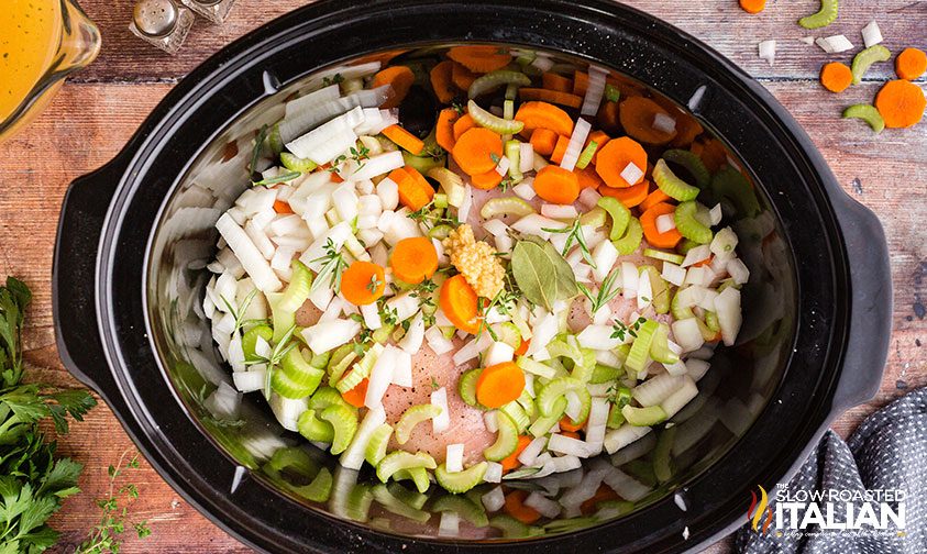 diced carrots, onion and celery in a slow cooker