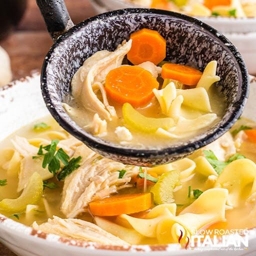 slow cooker chicken noodle soup in ladle