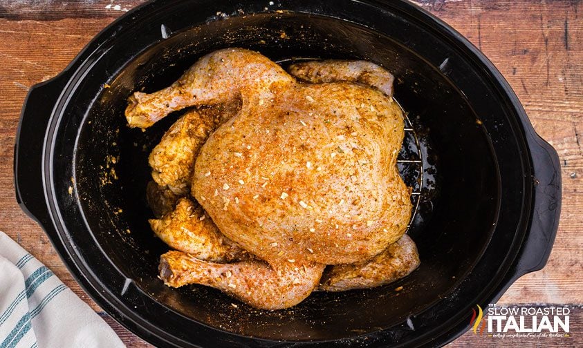 whole chicken with seasoning in crock pot