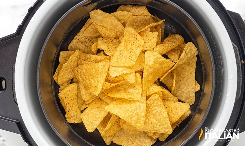 tortilla chips in basket of air fryer