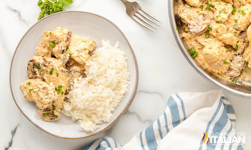 mushroom chicken with rice on white plate