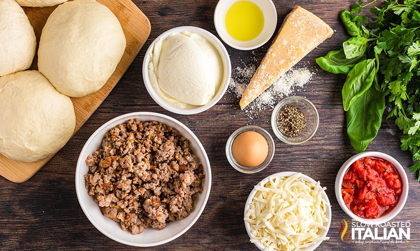 italian calzone recipe ingredients in bowls on counter