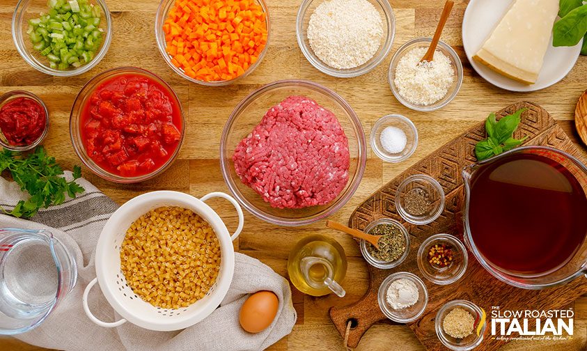 overhead: meatball soup recipe ingredients in separate glass bowls