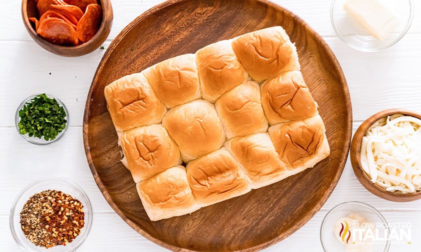 overhead: hawaiian dinner rolls on wooden platter