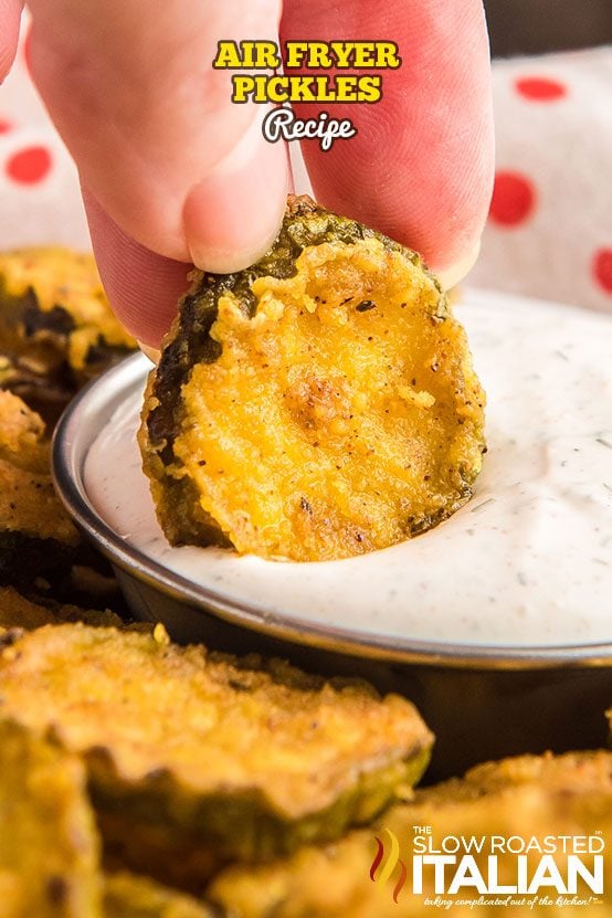 dipping deep fried pickles in ranch dip