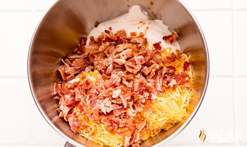 combining bacon cream cheese dip ingredients in mixing bowl