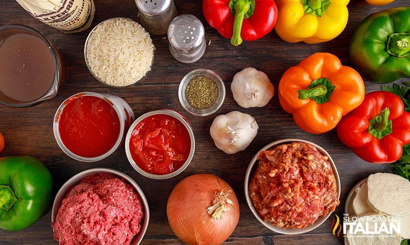 overhead: italian sausage stuffed peppers ingredients in small bowls