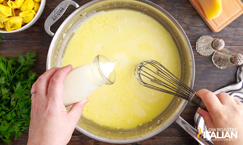 making alfredo sauce in a pan