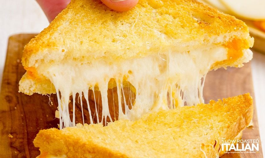 hot melted cheese pulling from sandwich