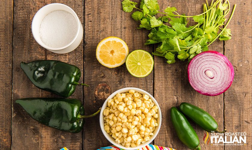 overhead: chipotle corn salsa recipe ingredients on wooden board